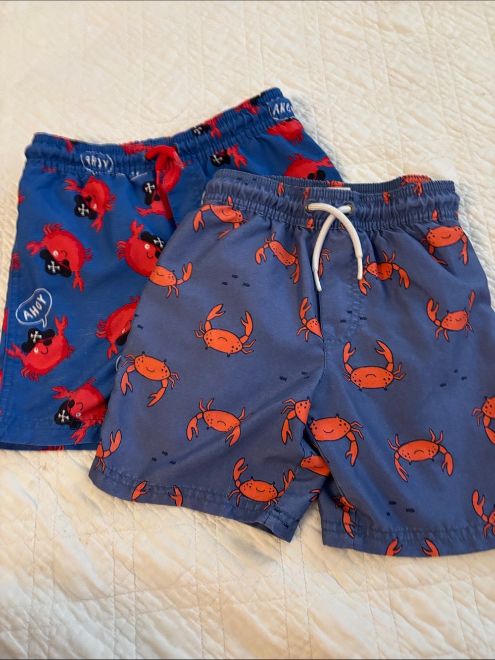 Carter's Blue Swim Shorts with Red Crab Print - 2 pair.